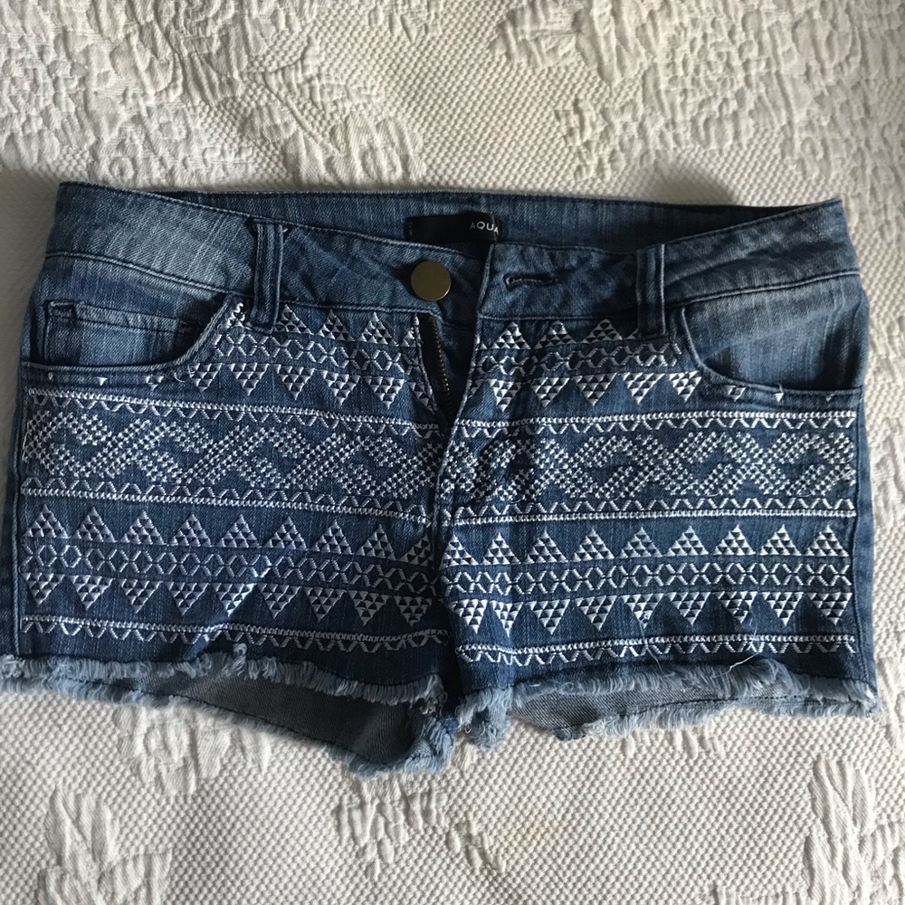 Aqua denim shorts with stitched embellishments
